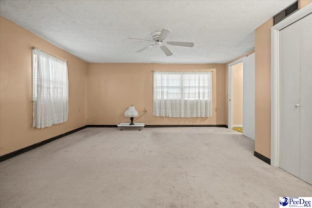 1101 E 3rd Ave, Lake View, SC 29563 - carpeted empty room with a textured ceiling, a ceiling fan, and baseboards