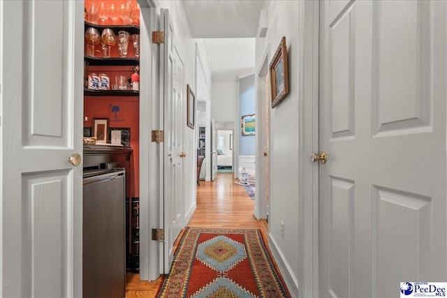 130 Nez Perce Dr, Darlington, SC 29532 - hall featuring light wood finished floors, a wainscoted wall, crown molding, and a decorative wall