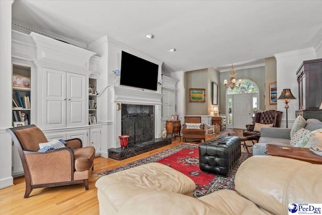 130 Nez Perce Dr, Darlington, SC 29532 - living room featuring crown molding, light wood-style flooring, a chandelier, a high end fireplace, and recessed lighting