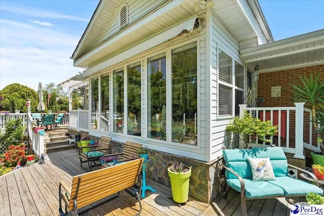 wooden deck with outdoor dining area