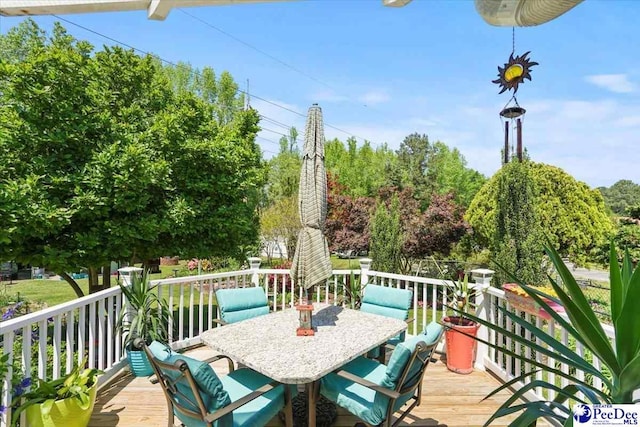 wooden deck with outdoor dining space