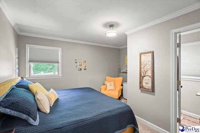 carpeted bedroom featuring baseboards and ornamental molding