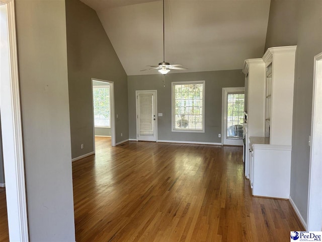 2143 Glenmore Way, Florence, SC 29505 - unfurnished living room featuring a ceiling fan, high vaulted ceiling, and dark wood-style flooring