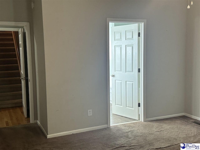 2143 Glenmore Way, Florence, SC 29505 - carpeted empty room with baseboards and stairs