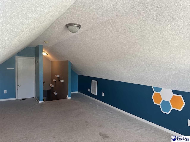 2143 Glenmore Way, Florence, SC 29505 - bonus room with a textured ceiling, carpet floors, and vaulted ceiling