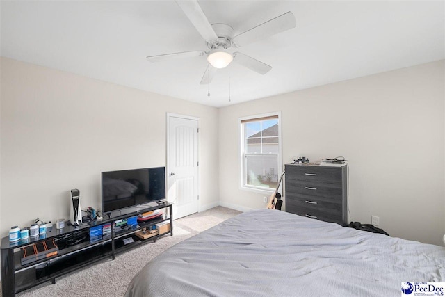 bedroom with light colored carpet and ceiling fan