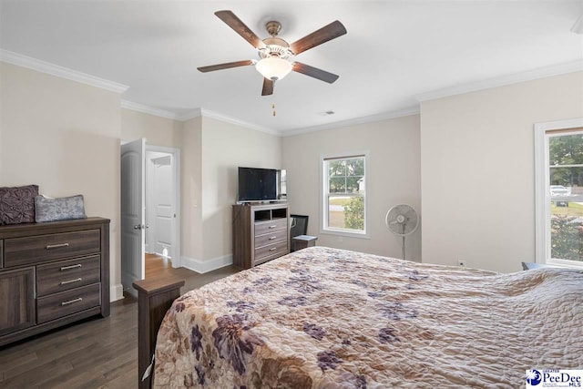 bedroom featuring dark wood-style flooring, crown molding, baseboards, and ceiling fan