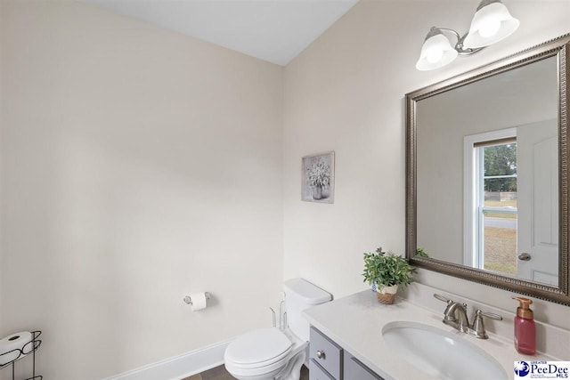 bathroom featuring vanity and toilet