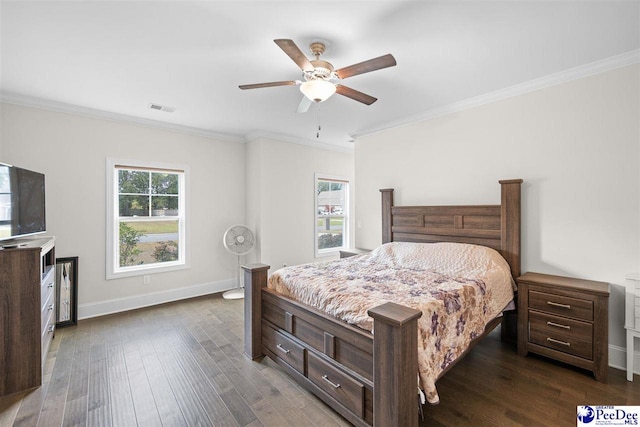 bedroom with ornamental molding, dark hardwood / wood-style floors, and ceiling fan