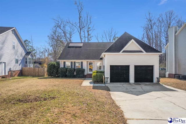 view of front of house with a garage, central AC unit, and a front yard