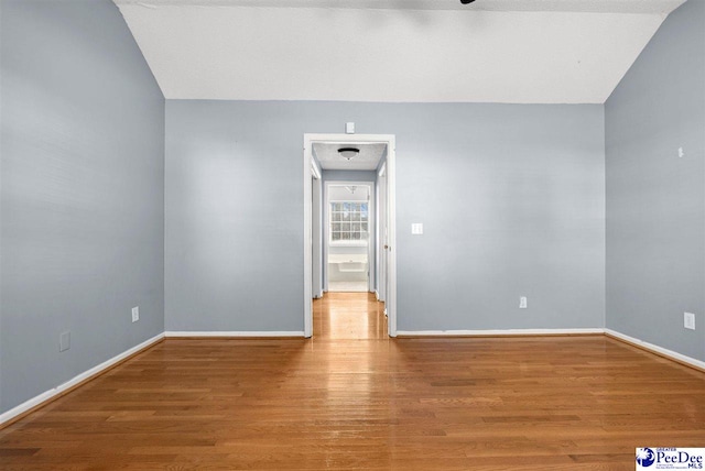 unfurnished room with hardwood / wood-style floors