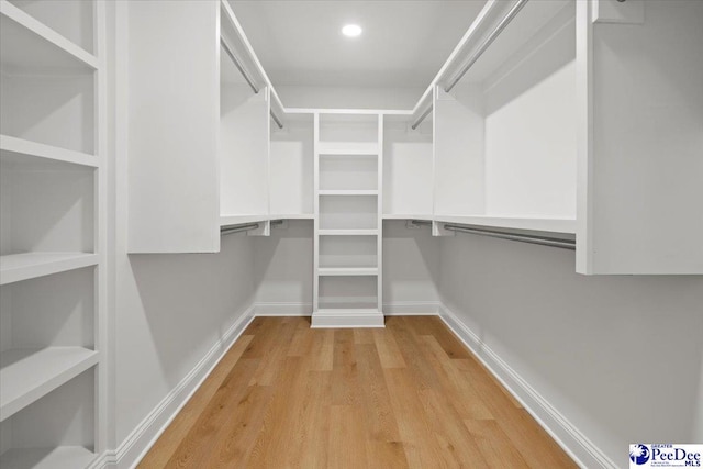 spacious closet with light wood-style floors