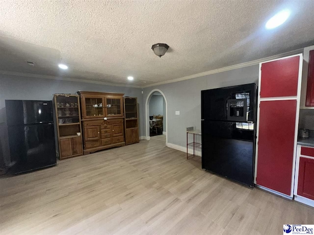 17 Shuler Dr, Sumter, SC 29150 - kitchen with freestanding refrigerator, arched walkways, light wood finished floors, ornamental molding, and a textured ceiling