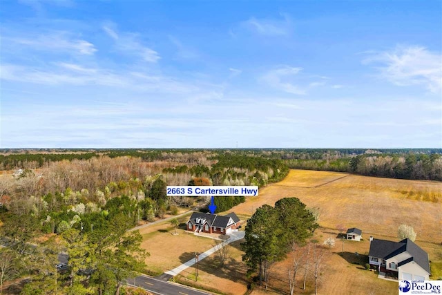 birds eye view of property featuring a rural view