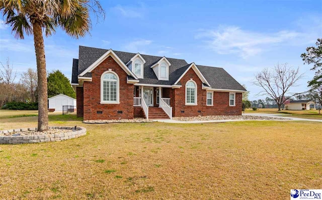 cape cod-style house featuring crawl space, brick siding, roof with shingles, and a front lawn