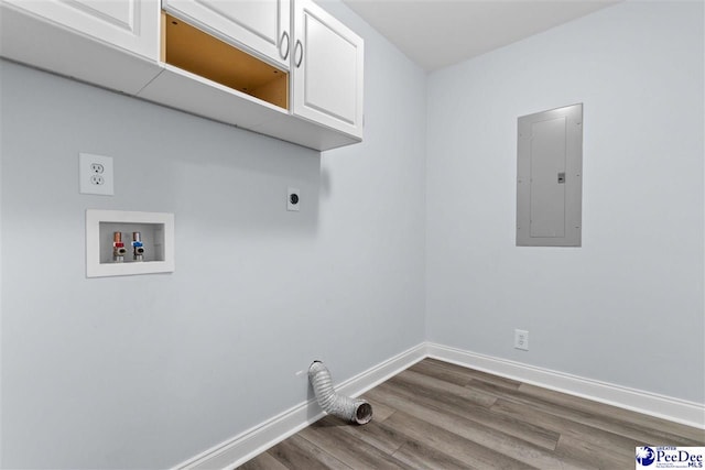 clothes washing area with baseboards, washer hookup, electric panel, cabinet space, and hookup for an electric dryer