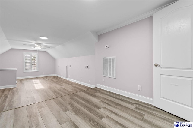 bonus room with visible vents, baseboards, ceiling fan, and wood finished floors