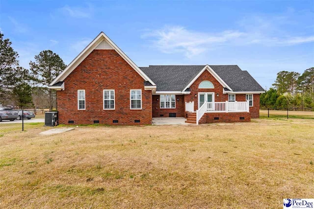 view of front of home with crawl space, a front yard, and fence