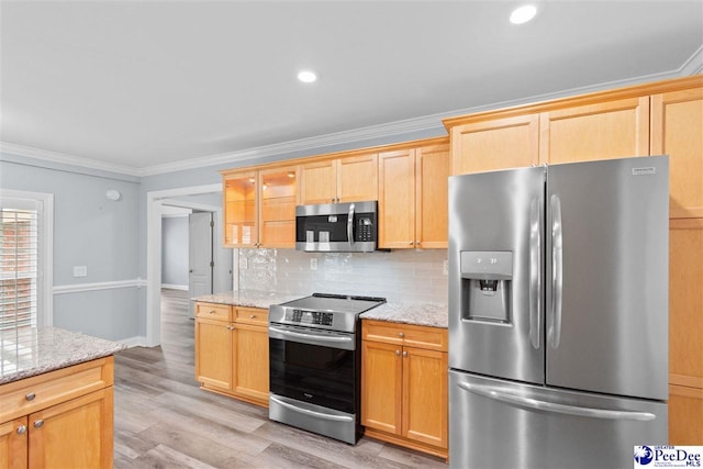 kitchen featuring light stone counters, ornamental molding, appliances with stainless steel finishes, tasteful backsplash, and light wood-type flooring