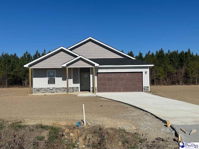 view of front of home with a garage, crawl space, and driveway