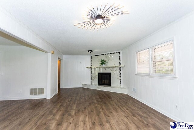2318 Heron Dr, Florence, SC 29501 - unfurnished living room with a premium fireplace, ornamental molding, and dark hardwood / wood-style floors