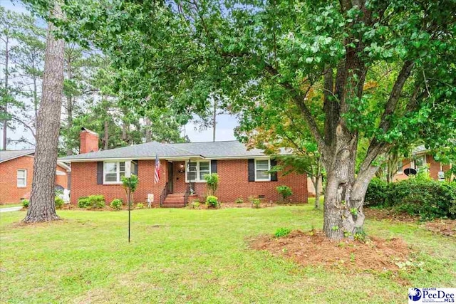 160 Central Dr, Florence, SC 29501 - single story home featuring a chimney, brick siding, and a front yard