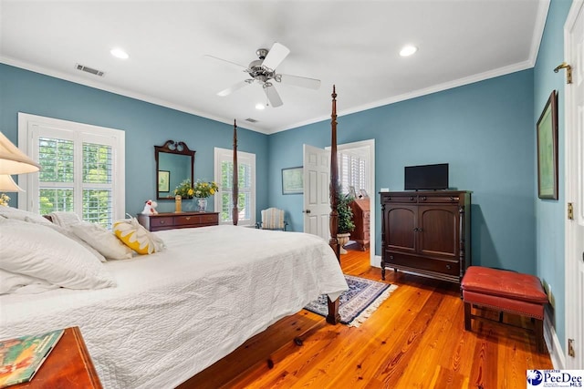 bedroom with ceiling fan, ornamental molding, and light wood-type flooring