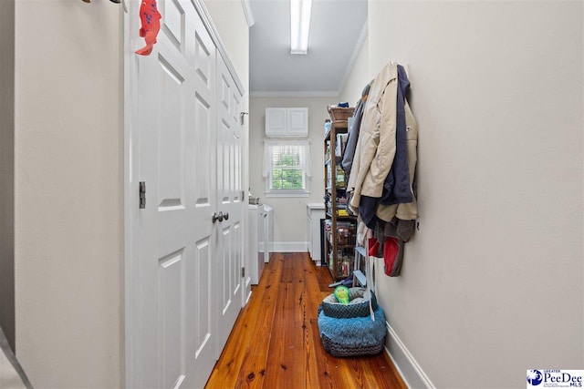 hallway featuring crown molding and wood-type flooring