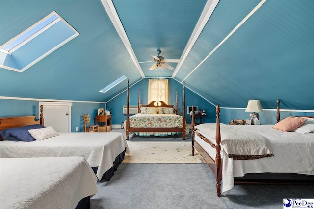 carpeted bedroom with lofted ceiling with skylight