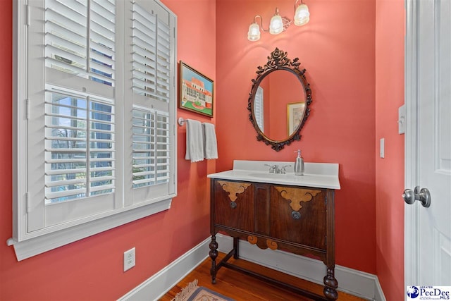 bathroom with vanity and hardwood / wood-style floors