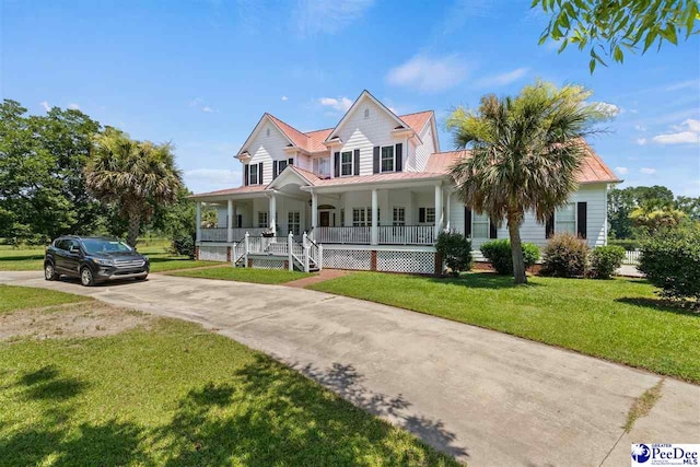 farmhouse-style home with a front yard and covered porch