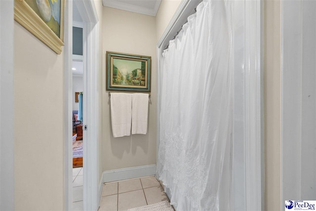 bathroom featuring crown molding and tile patterned flooring