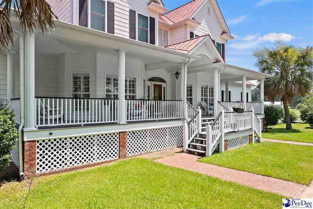 view of front of property featuring a front lawn and a porch