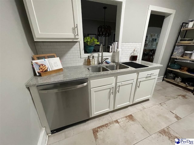 kitchen with white cabinetry, sink, decorative backsplash, and stainless steel dishwasher