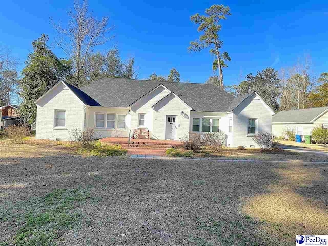 single story home with a wooden deck