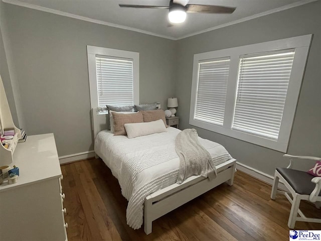 bedroom featuring ornamental molding, dark hardwood / wood-style floors, and ceiling fan