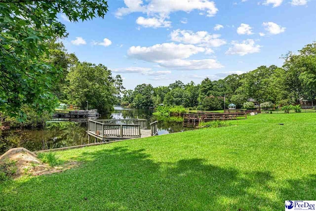 4105 Byrnes Blvd, Florence, SC 29506 - view of grassy yard featuring a water view and a dock