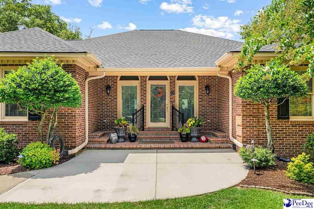 4105 Byrnes Blvd, Florence, SC 29506 - entrance to property featuring brick siding and a shingled roof