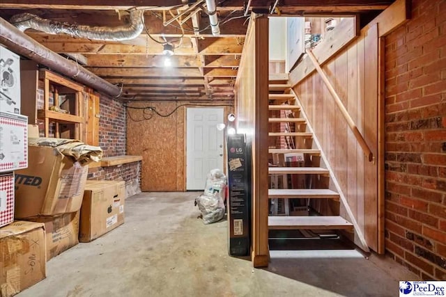 basement with brick wall