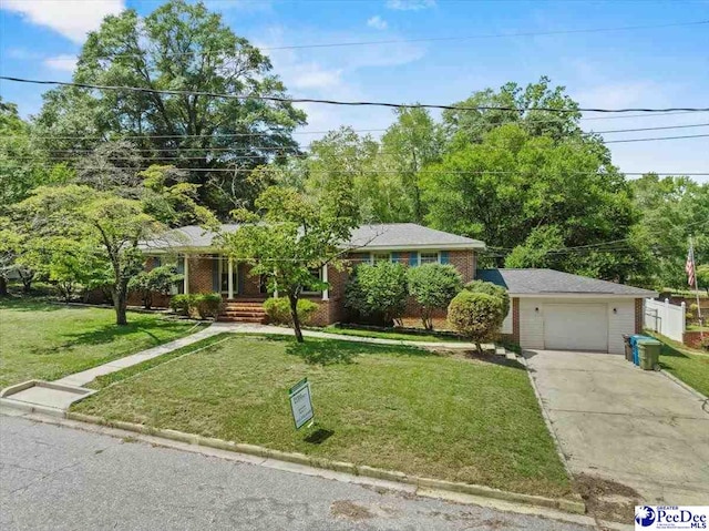 view of front of property featuring a garage and a front lawn