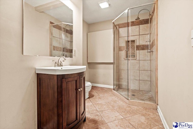 bathroom with vanity, toilet, an enclosed shower, and tile patterned flooring