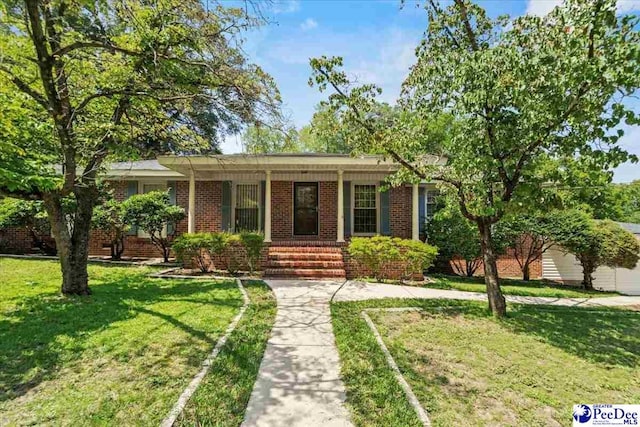 ranch-style home with a front yard