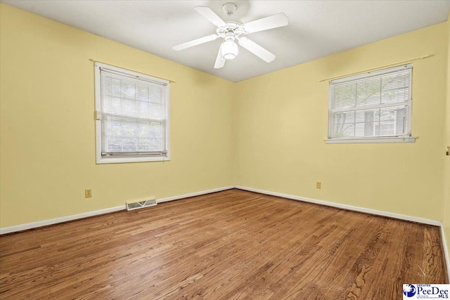 unfurnished room featuring wood-type flooring and ceiling fan