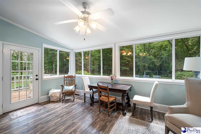2409 Sarazen Ct, Florence, SC 29506 - sunroom featuring lofted ceiling, wood finished floors, a wooden deck, baseboards, and ornamental molding