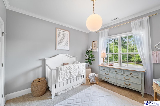 2409 Sarazen Ct, Florence, SC 29506 - carpeted bedroom with crown molding, a crib, and baseboards