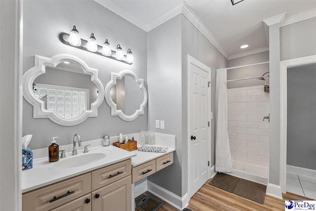 2409 Sarazen Ct, Florence, SC 29506 - full bath with tiled shower, vanity, wood finished floors, ornamental molding, and baseboards