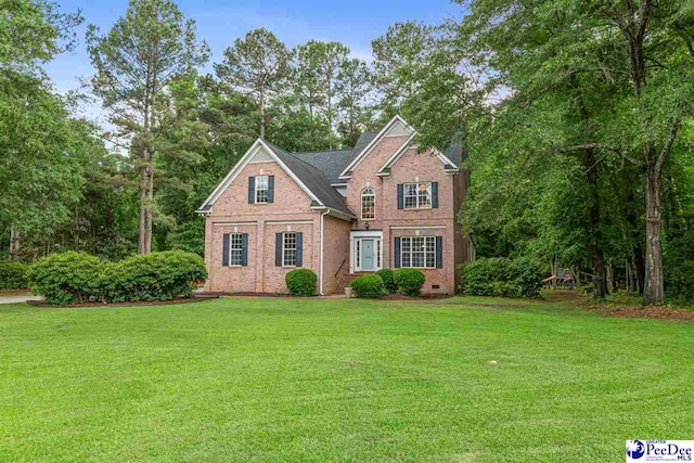 2409 Sarazen Ct, Florence, SC 29506 - view of front facade featuring a front yard and brick siding