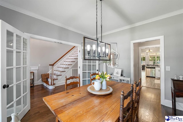 2409 Sarazen Ct, Florence, SC 29506 - dining area with a chandelier, french doors, stairway, wood finished floors, and ornamental molding