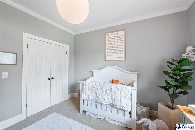 2409 Sarazen Ct, Florence, SC 29506 - carpeted bedroom with crown molding, a closet, and baseboards