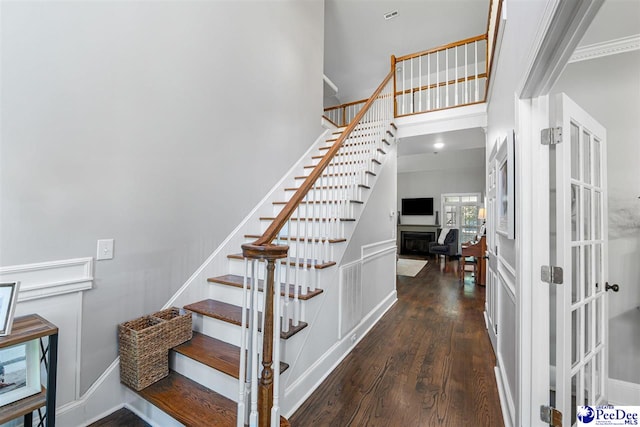 2409 Sarazen Ct, Florence, SC 29506 - staircase with wood finished floors and ornamental molding